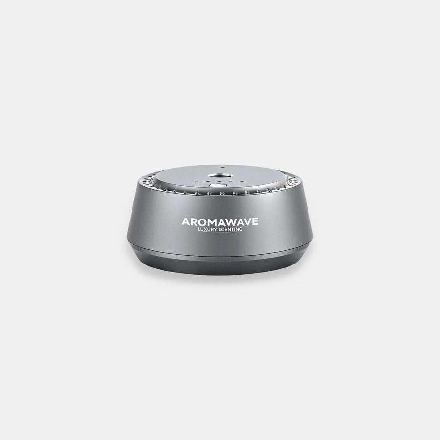 Aromawave Neo Sense Pro car diffuser with motion sensor and ultrasonic heat-free diffusion, sleek silver luxury in-car scenting device