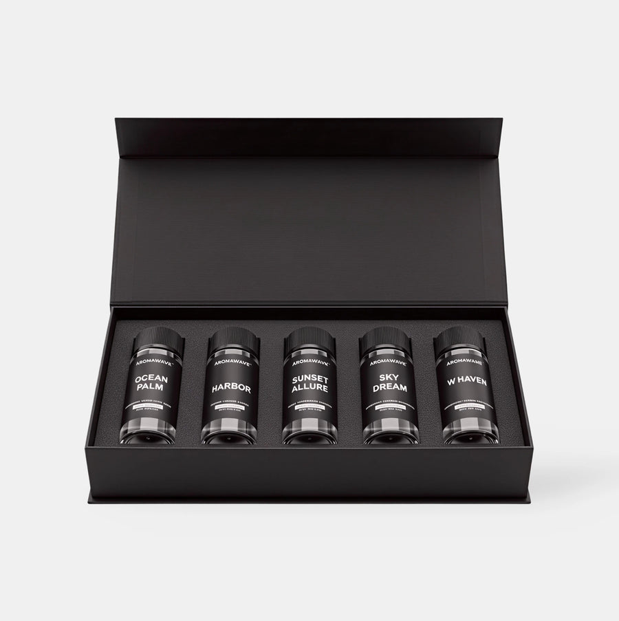 Open Aromawave Resort Living Premium fragrance oil gift set showing five 20ml luxury diffuser oils in a black magnetic box