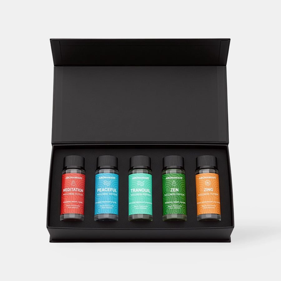 Open Aromawave Wellness Edition Signature fragrance oil gift set showing five 50ml luxury diffuser oils in a black magnetic box